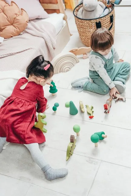 Deux enfants jouant avec des jouets en bois sur le sol